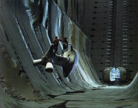 Azel and Edge travelling through underground ruins.